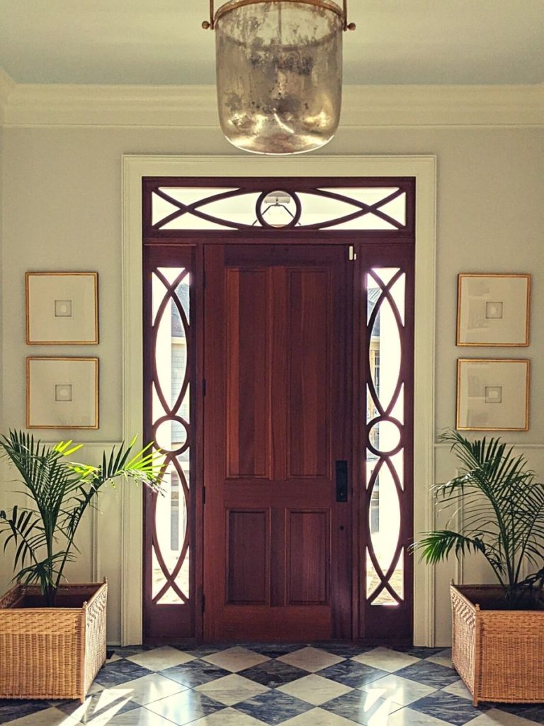 Checkerboard floors with wicker planters and palms circa lighting